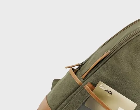 Ondrela gold card tucked into a backpack pocket