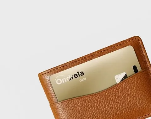Ondrela gold card inside a leather wallet card slot